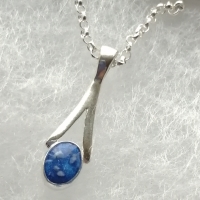 Small silver pendant with cremation ashes
