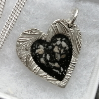 Double sided Silver pendant with cremation ashes